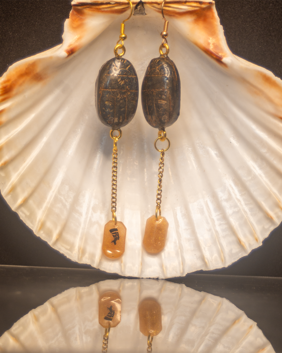 Khepri Dawn - Scarab earrings in black resin with golden highlights